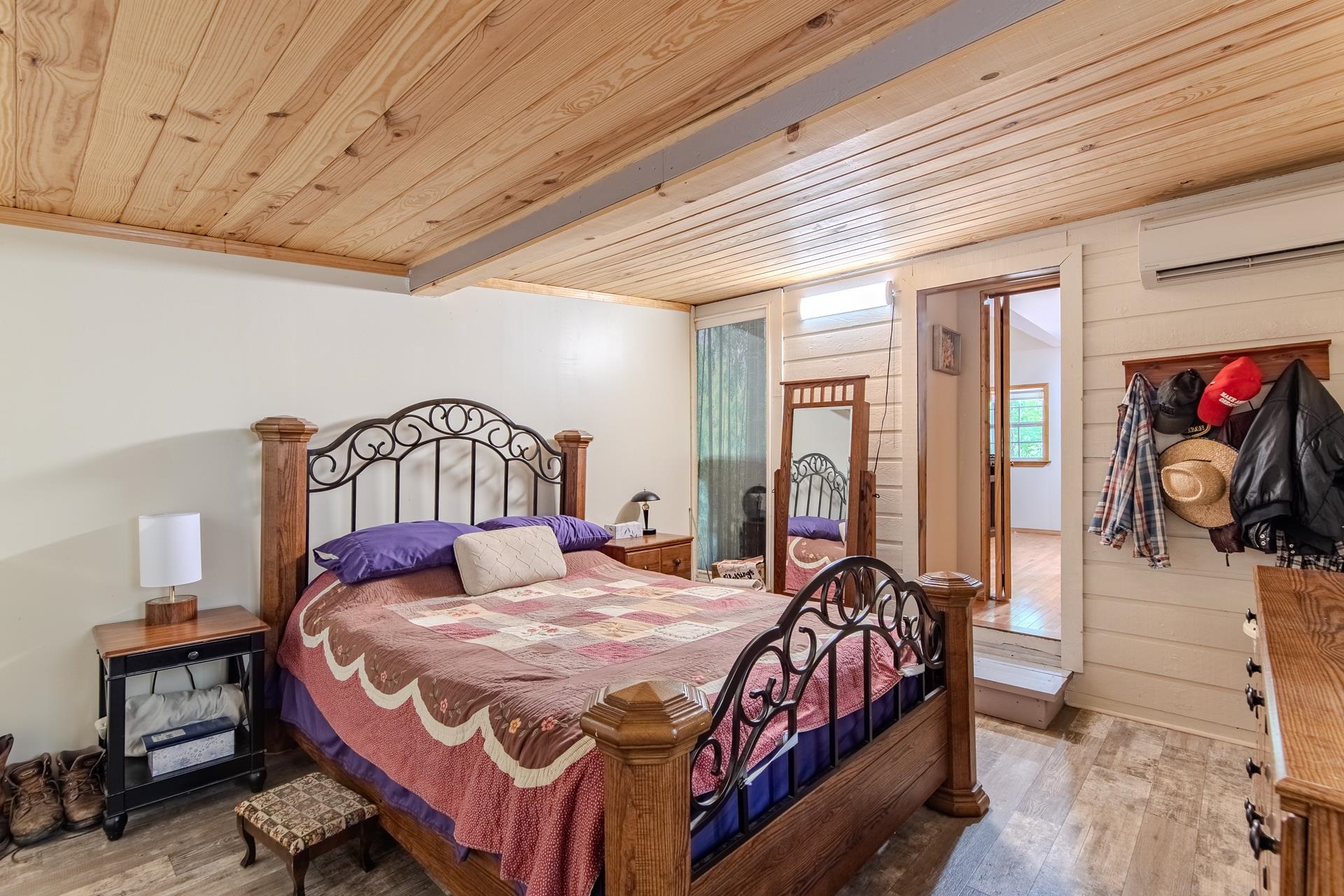 23 Old Ferry Road Bath Springs, TN 38311 - Photo 24 of 40 a bedroom with a bed and wooden floor