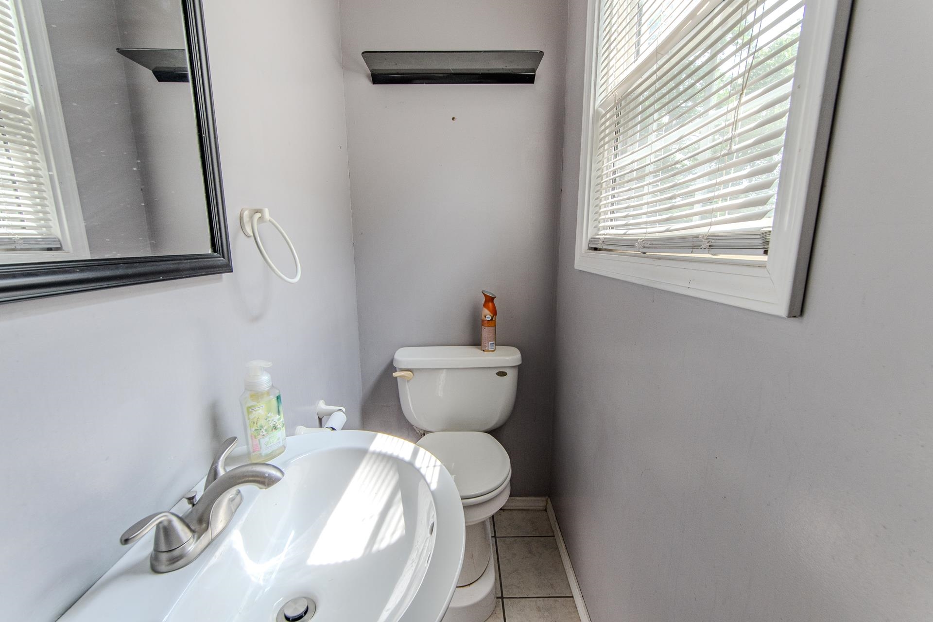 23 Old Ferry Road Bath Springs, TN 38311 - Photo 33 of 40 a bathroom with a toilet and a sink