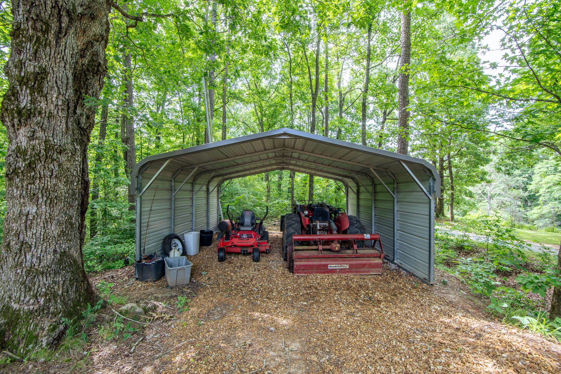 23 Old Ferry Road Bath Springs, TN 38311 - Photo 34 of 40 a view of deck with table and chairs under an umbrella