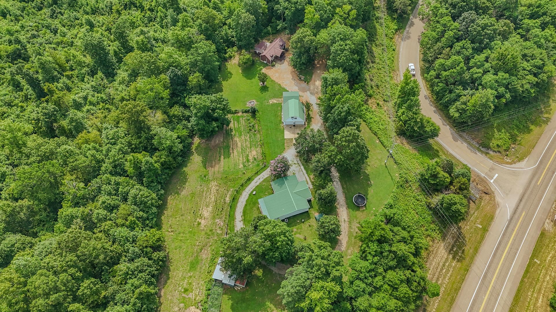 23 Old Ferry Road Bath Springs, TN 38311 - Photo 39 of 40 an aerial view of residential house with outdoor space and trees all around