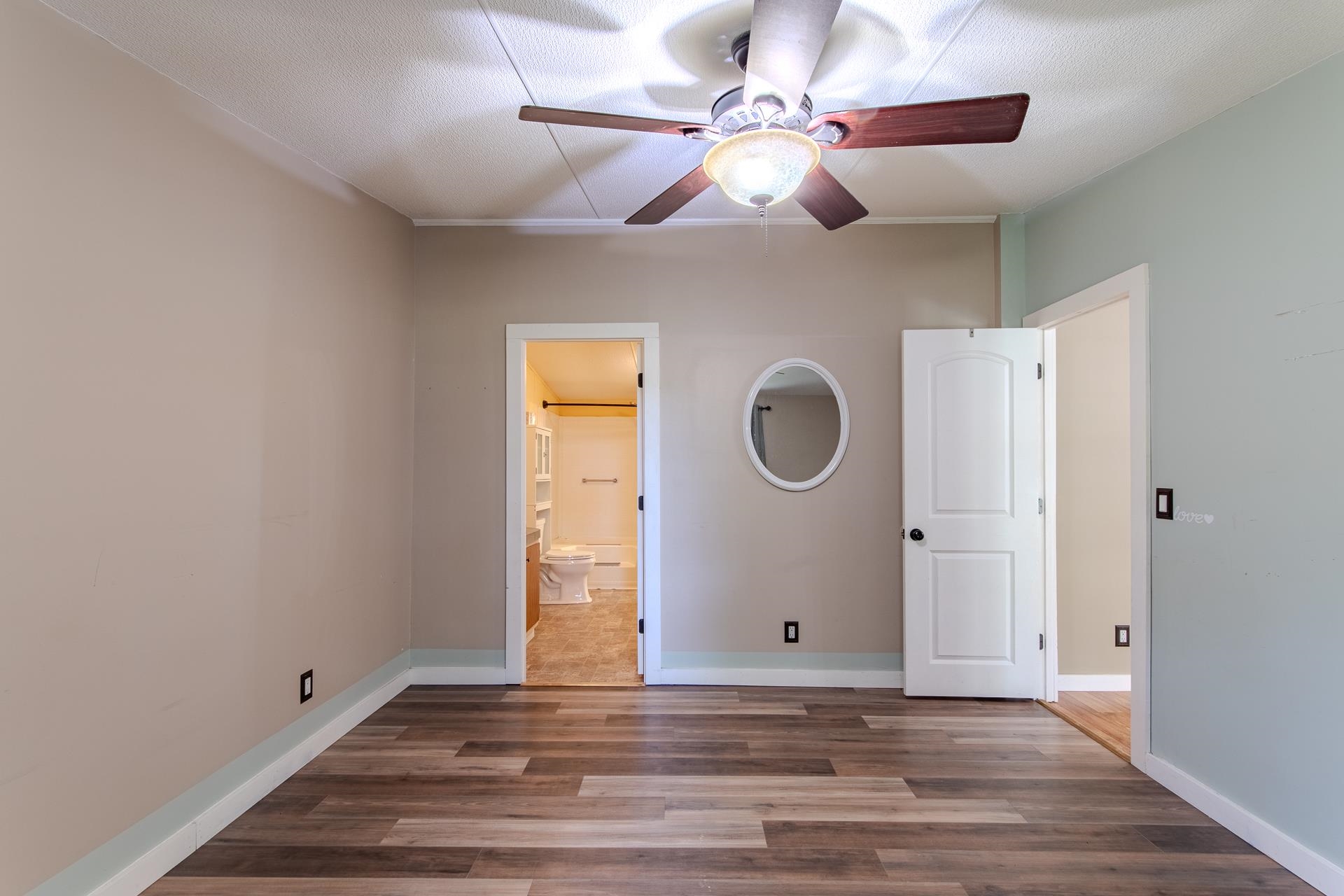 23 Old Ferry Road Bath Springs, TN 38311 - Photo 10 of 40 a view of a livingroom with wooden floor