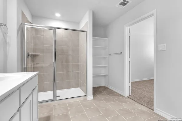 a bathroom with a sink double vanity and a mirror