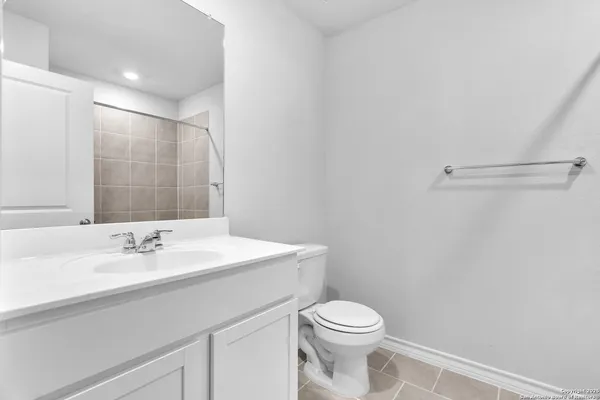 a bath tub sitting next to a shower