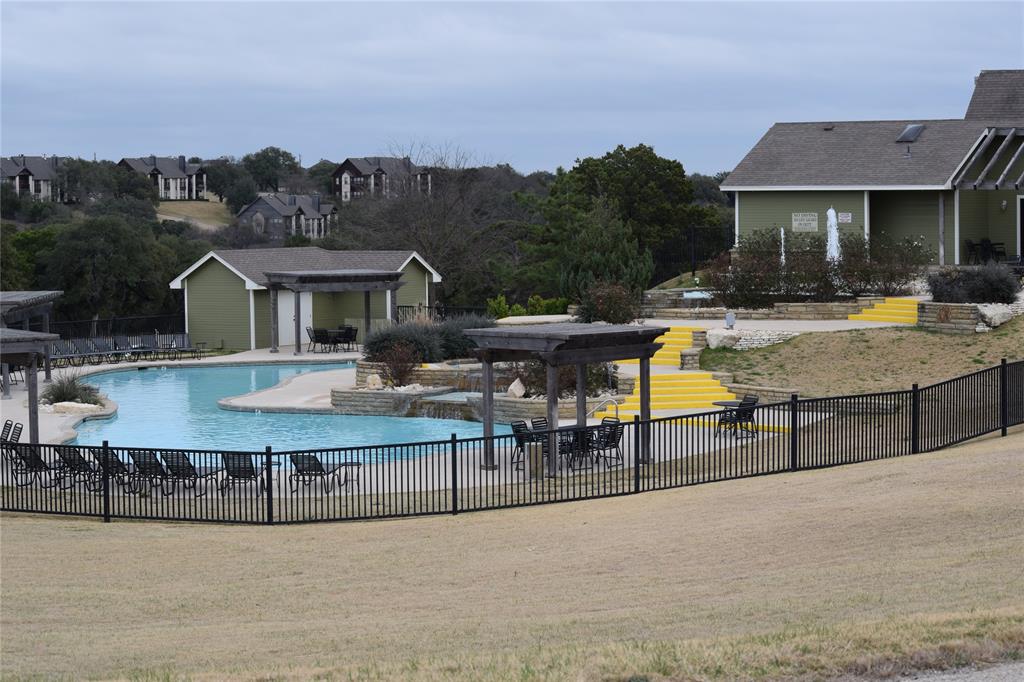 28003 White Bluff Drive Whitney, TX 76692 - Photo 4 of 17 Community pool featuring a pergola and a patio