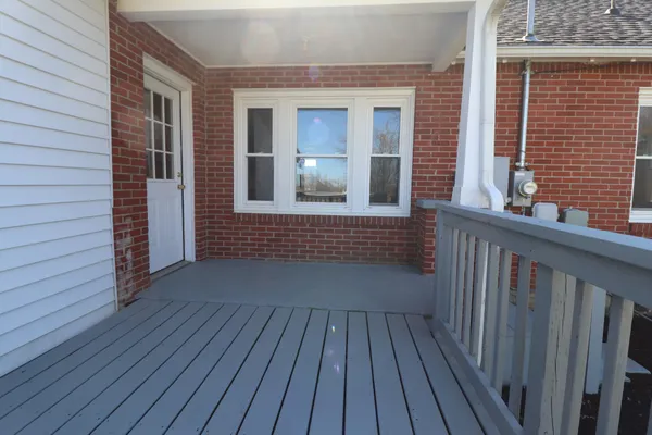 a view of a brick house with wooden floor