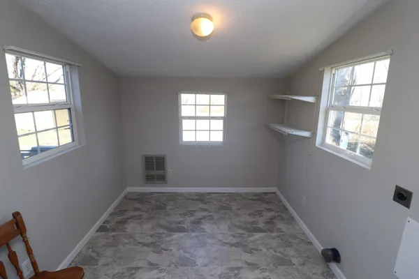 an empty room with windows