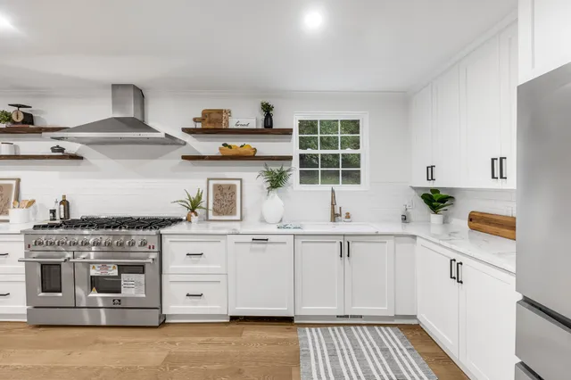 a dining room with furniture and wooden floor