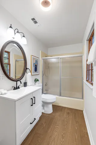 a view of backyard with deck and wooden floor