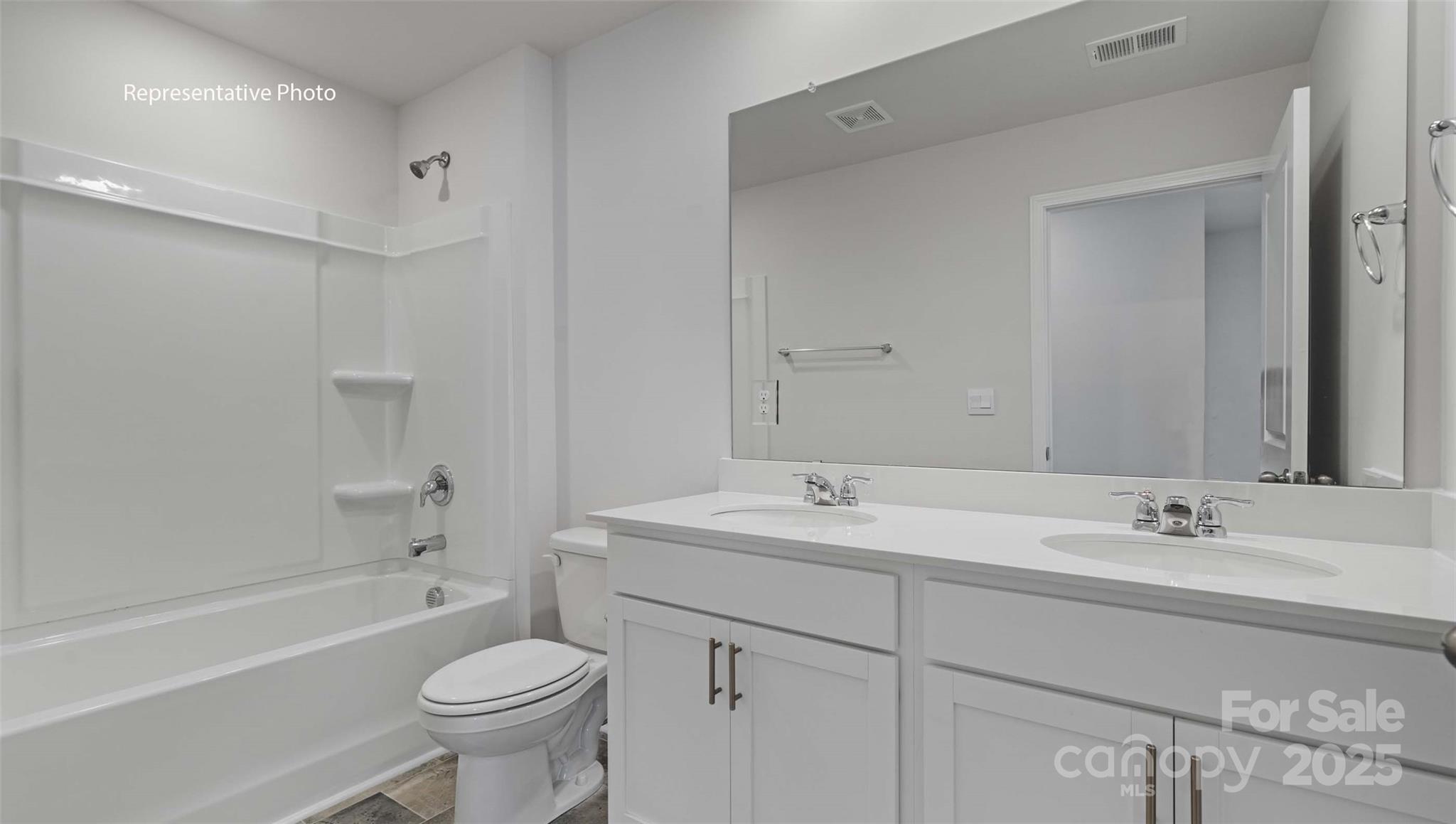 4108 Summey Trail Lincolnton, NC 28092 - Photo 24 of 28 a bathroom with a double vanity sink toilet mirror and bathtub
