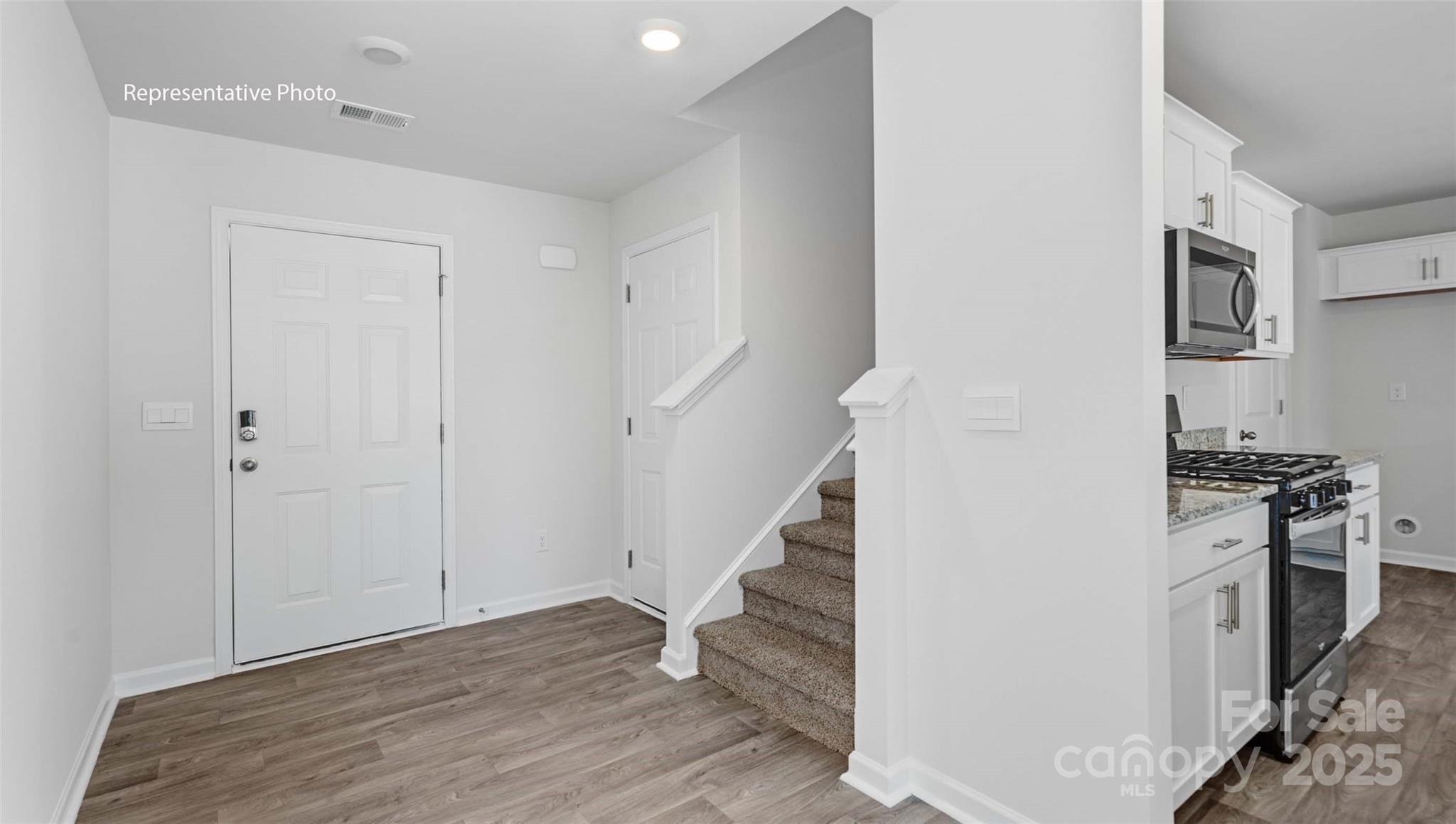 4108 Summey Trail Lincolnton, NC 28092 - Photo 3 of 28 a view of a kitchen with a stove top oven and cabinets