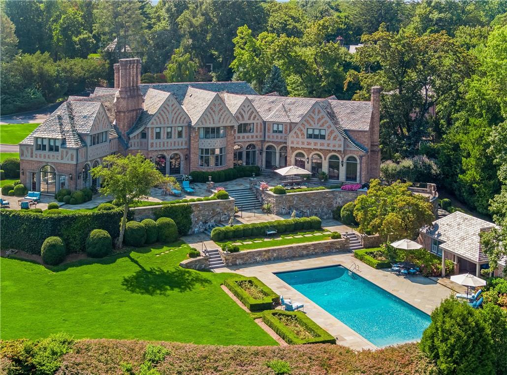 a aerial view of a house with yard