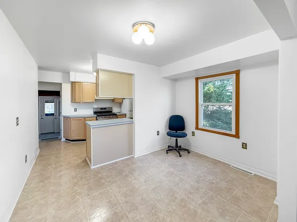 a workspace with furniture and window