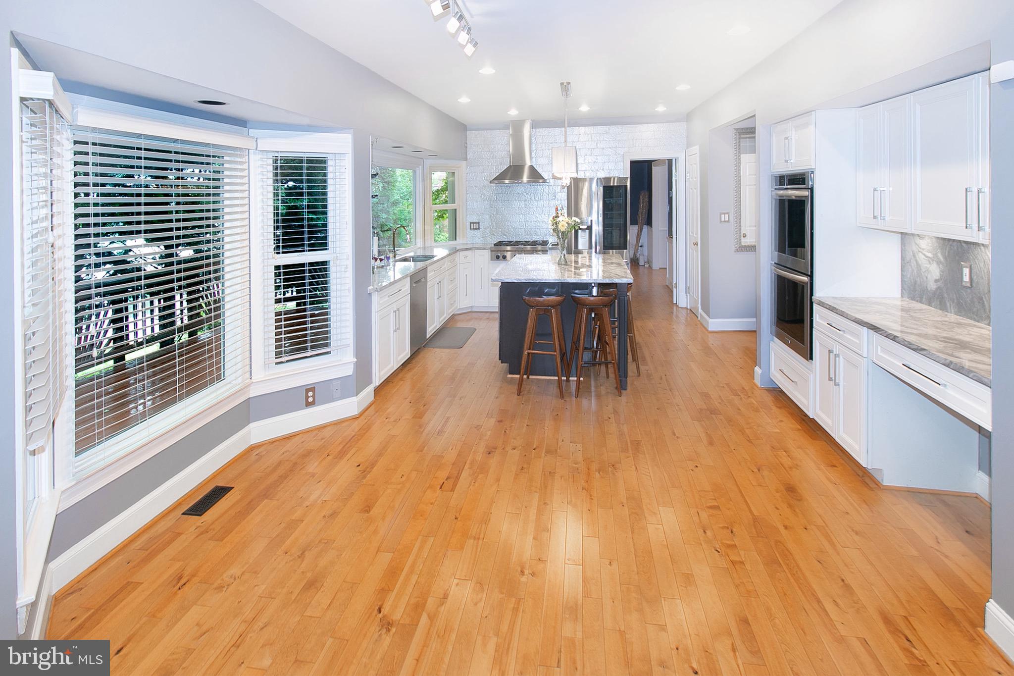 13500 Over Ridge Court Chantilly, VA 20151 - Photo 13 of 41 a large kitchen with a table and chairs in it