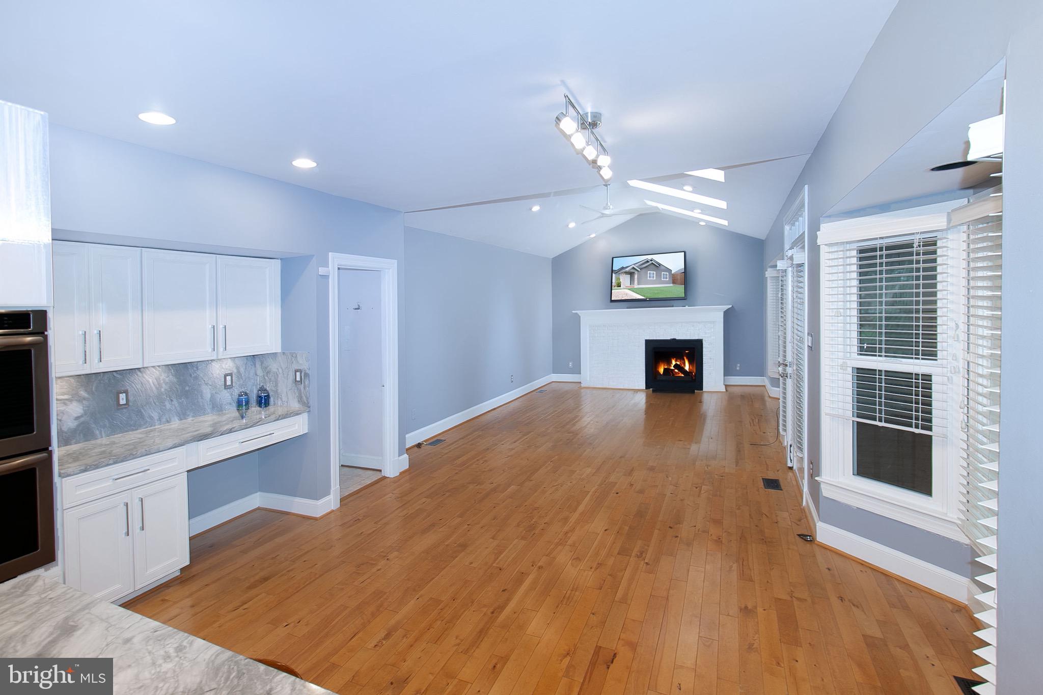 13500 Over Ridge Court Chantilly, VA 20151 - Photo 14 of 41 a open kitchen with kitchen island a refrigerator stove and sink
