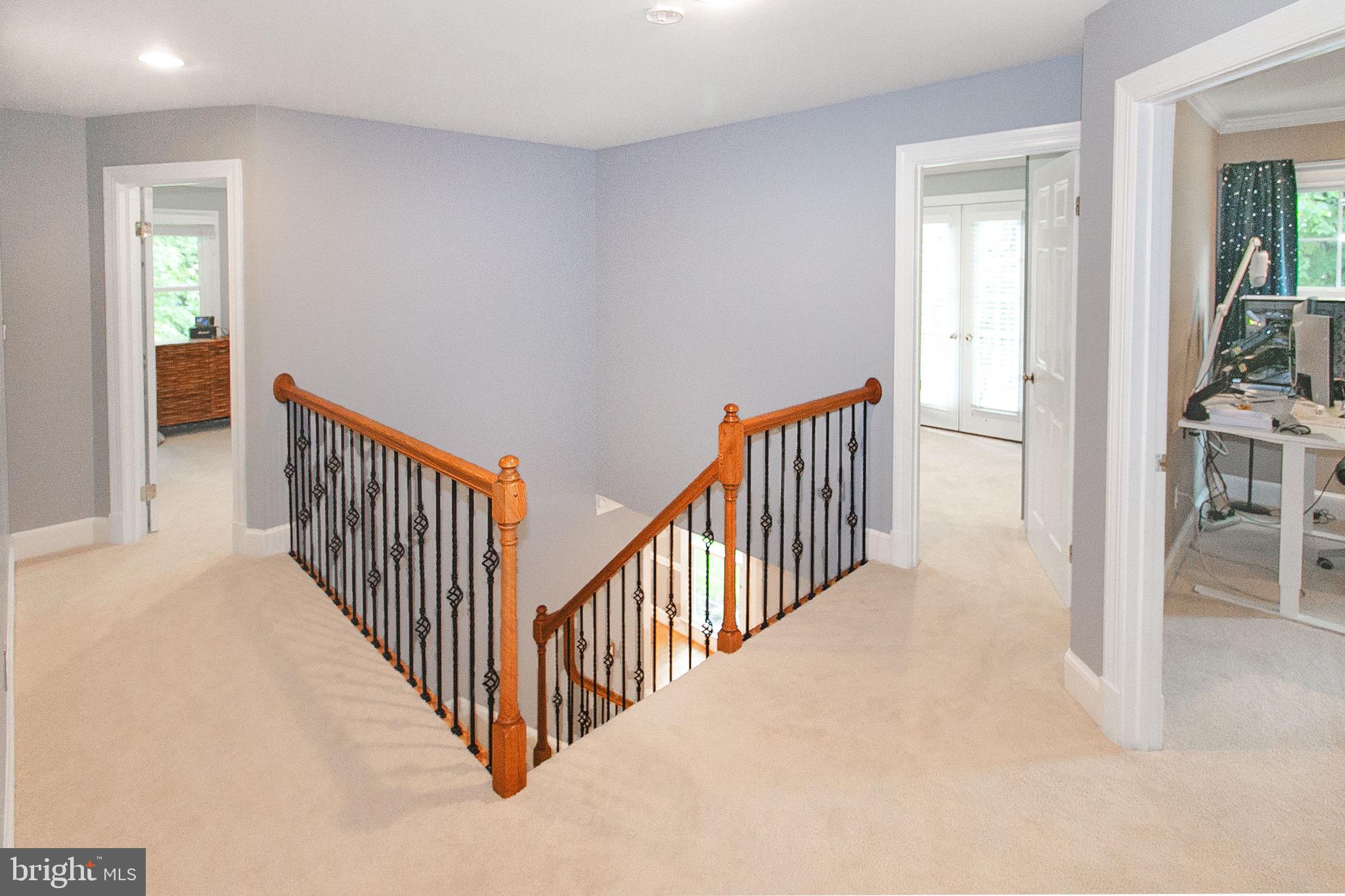 13500 Over Ridge Court Chantilly, VA 20151 - Photo 18 of 41 a view of a hallway with wooden floor and stairs