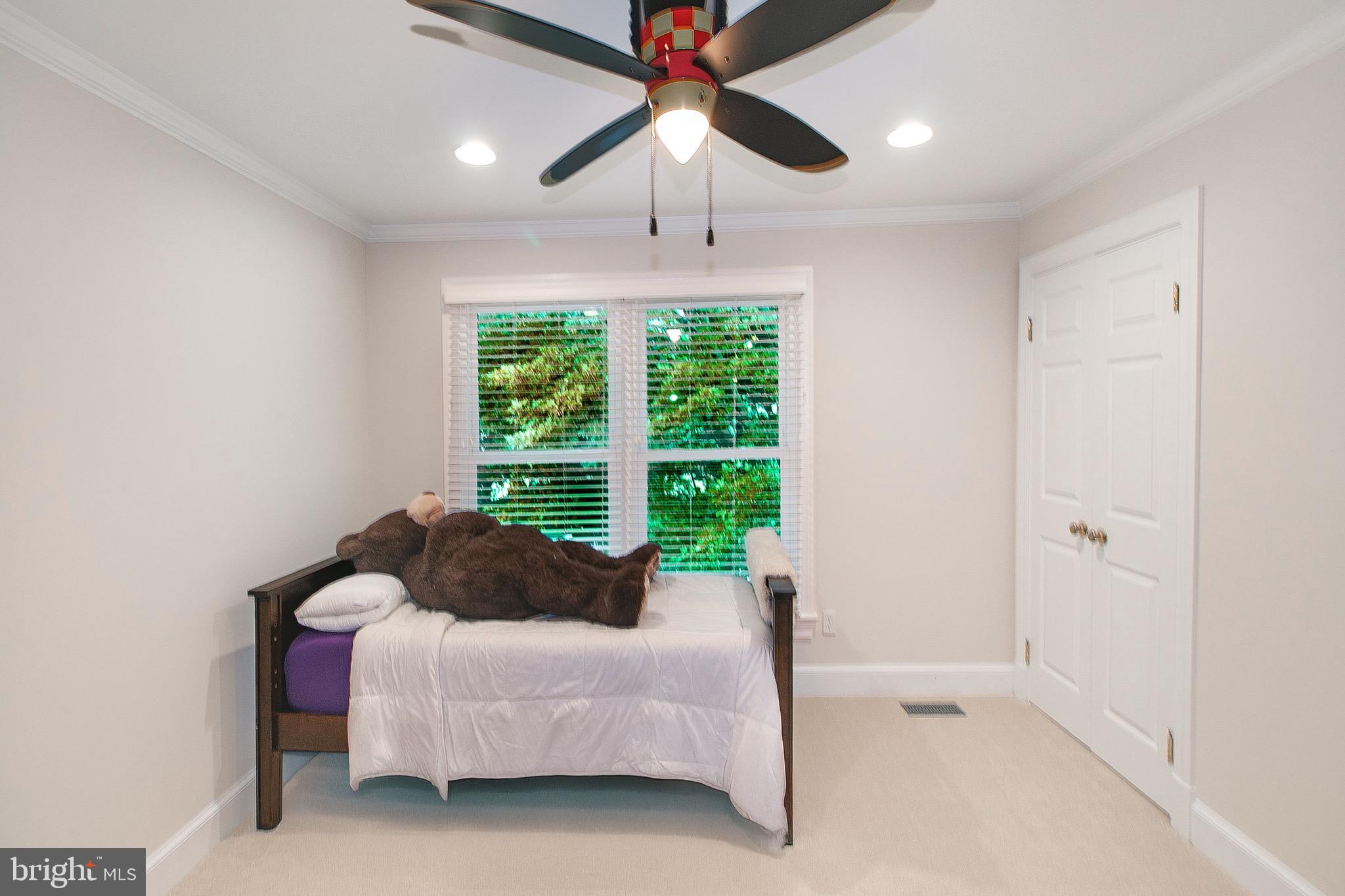 13500 Over Ridge Court Chantilly, VA 20151 - Photo 28 of 41 a bed room with a bed and a chandelier