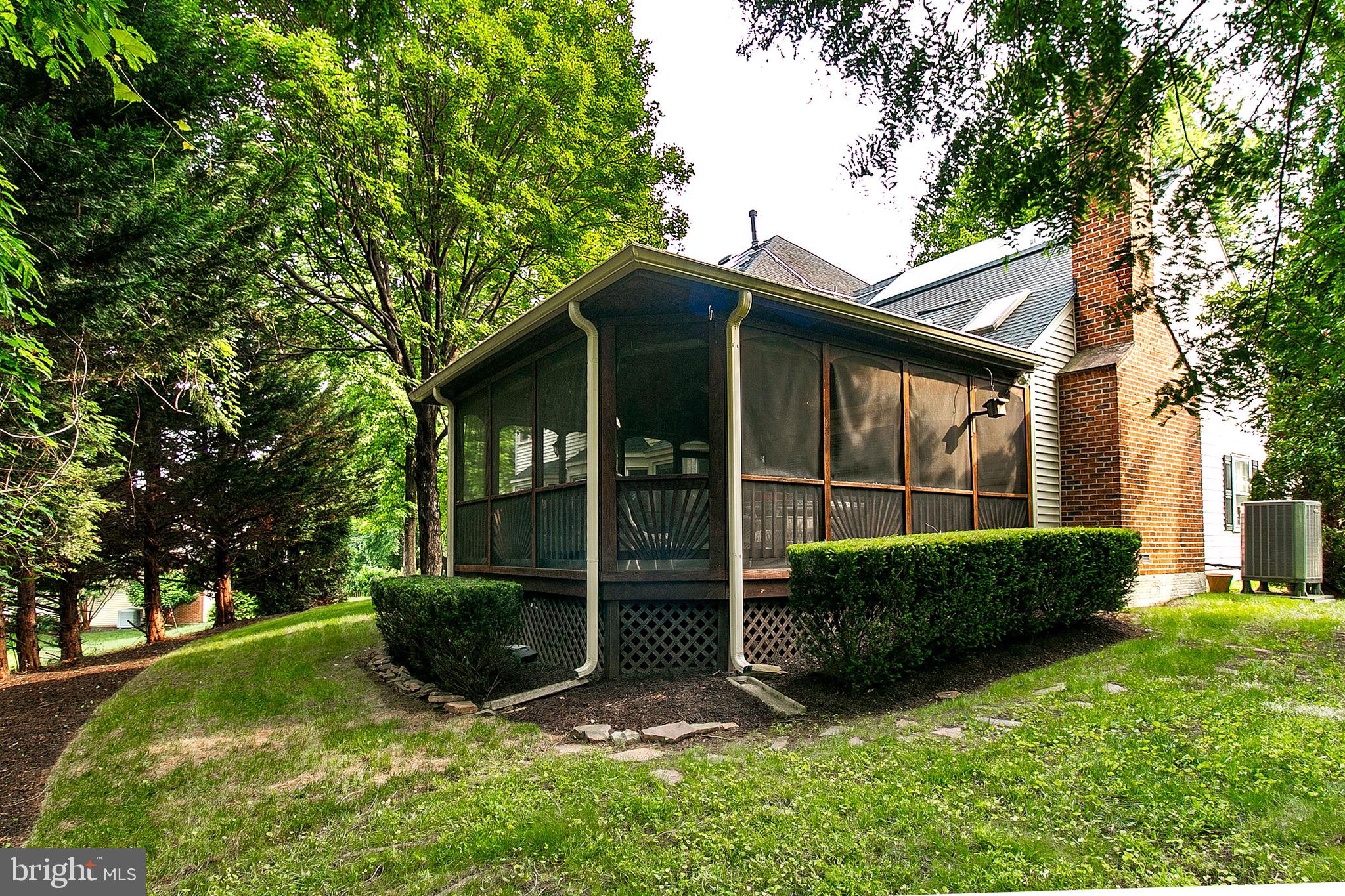 13500 Over Ridge Court Chantilly, VA 20151 - Photo 37 of 41 a view of a wooden house with a big yard and large trees