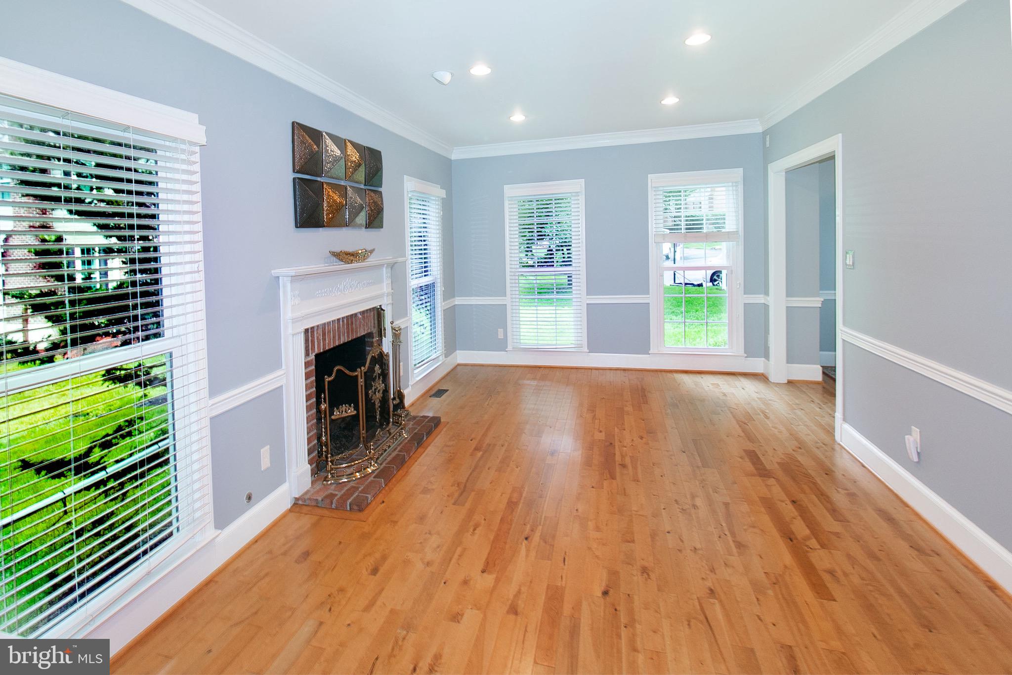 13500 Over Ridge Court Chantilly, VA 20151 - Photo 7 of 41 a view of livingroom with furniture a fireplace and wooden floor