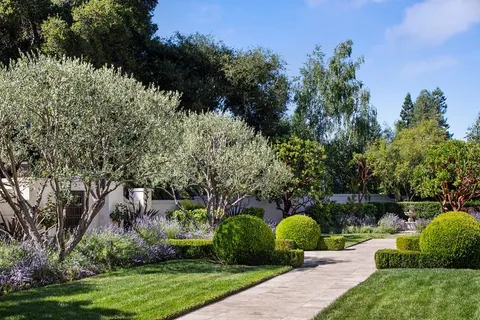 a view of a table and chairs in the garden