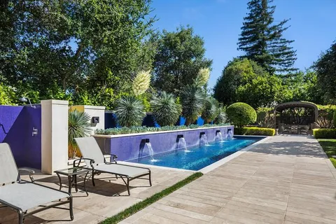 a view of house with pool porch and outdoor seating