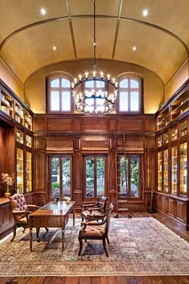 a living room with patio furniture and a large window