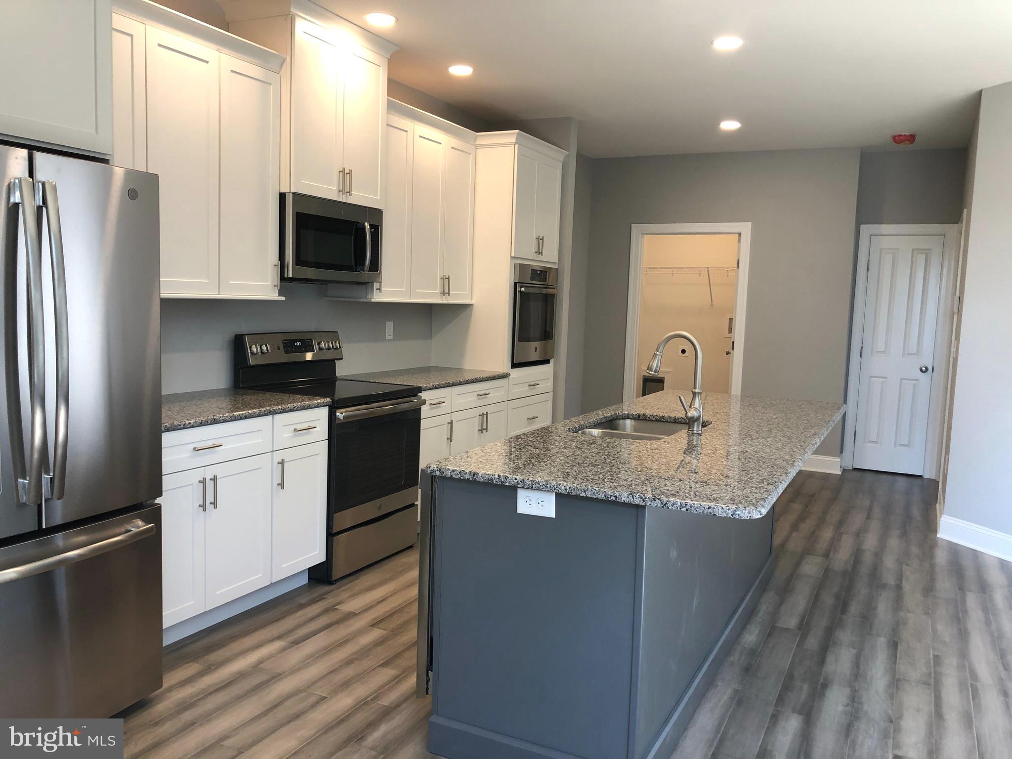Kitchen view with laminate flooring