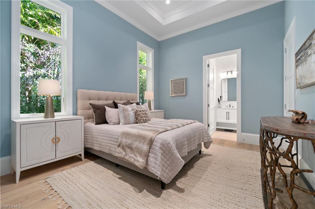 3290 Crayton Road Naples, FL 34103 - Photo 30 of 50 a bedroom with a bed and a window