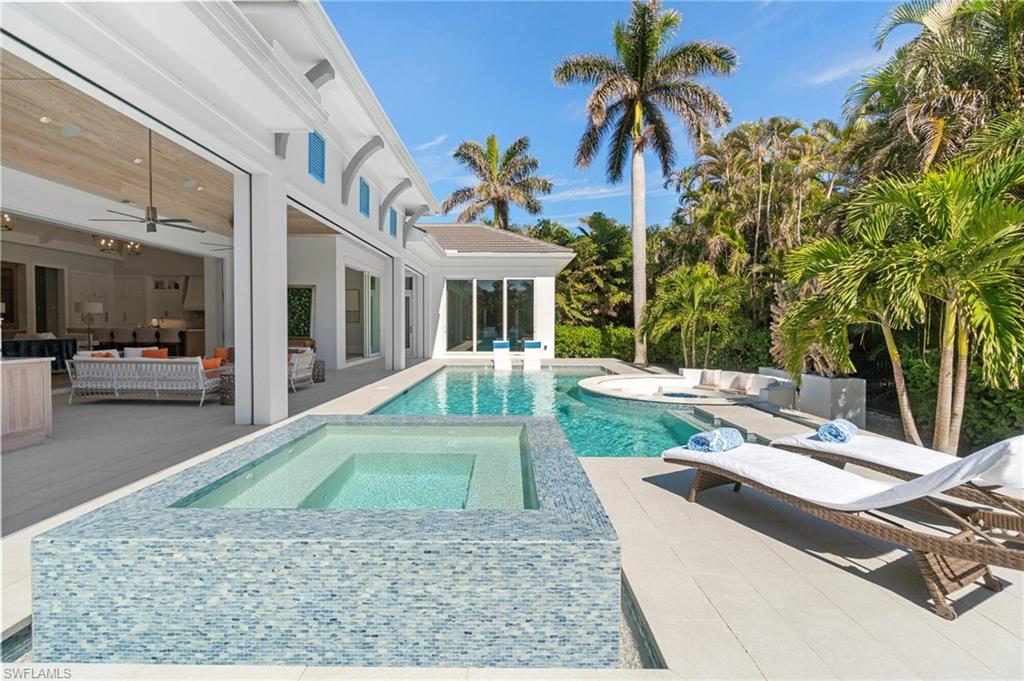 3290 Crayton Road Naples, FL 34103 - Photo 44 of 50 a view of a house with backyard and sitting area