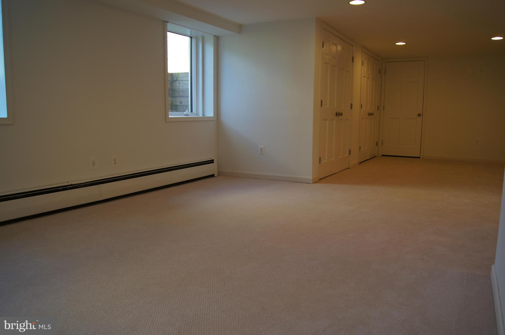 906 Rappaix Court Baltimore, MD 21286 - Photo 14 of 29 Lower level bright family room. Gas heat.