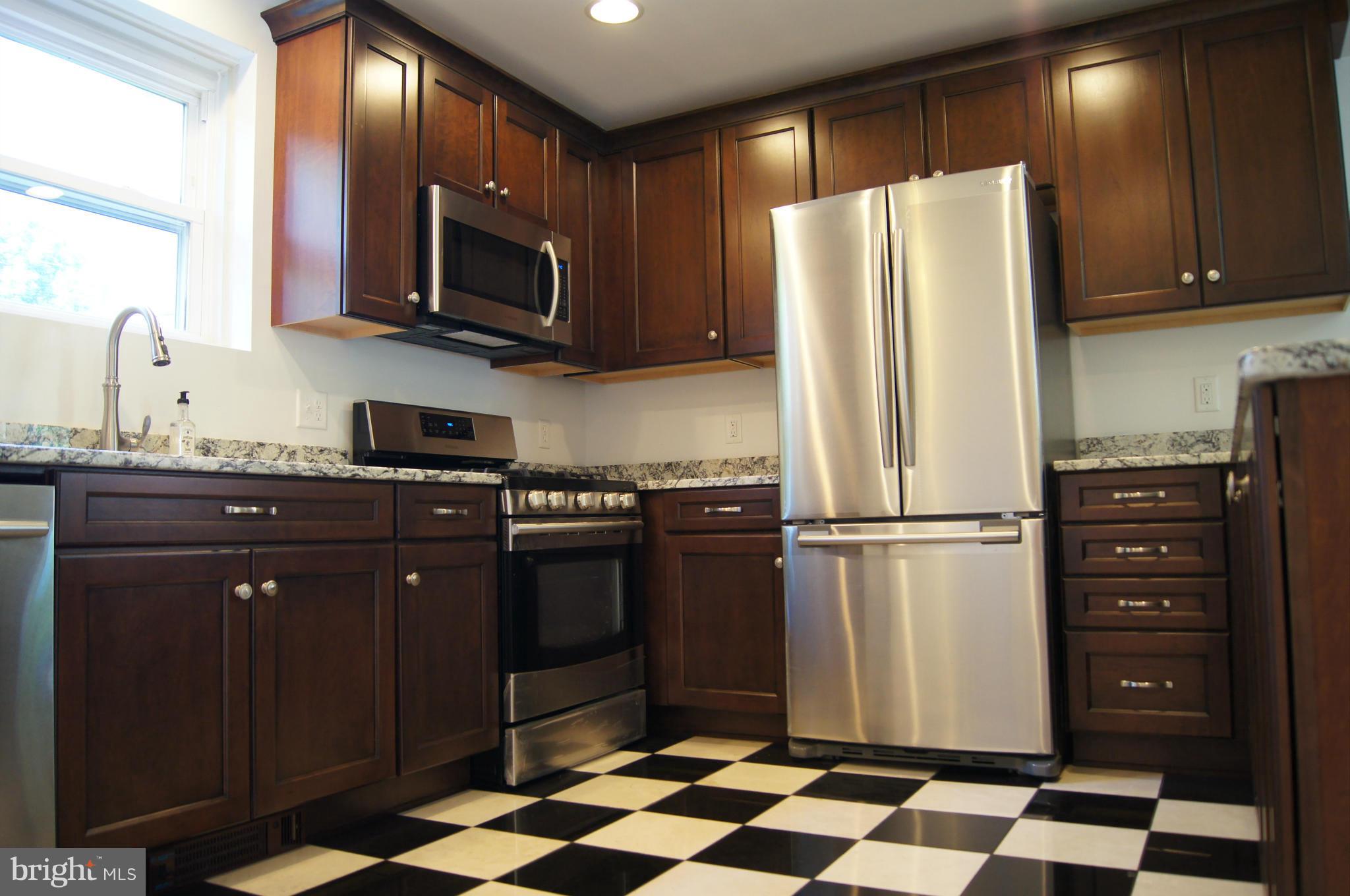 906 Rappaix Court Baltimore, MD 21286 - Photo 4 of 29 New kitchen w/ marble, stainless, granite
