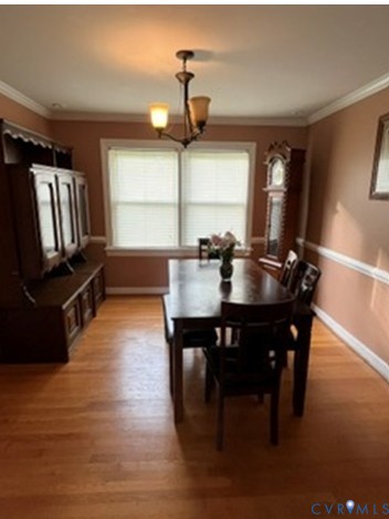 3732 Birdwood Road Richmond, VA 23234 - Photo 8 of 28 a view of a dining room with furniture window and wooden floor