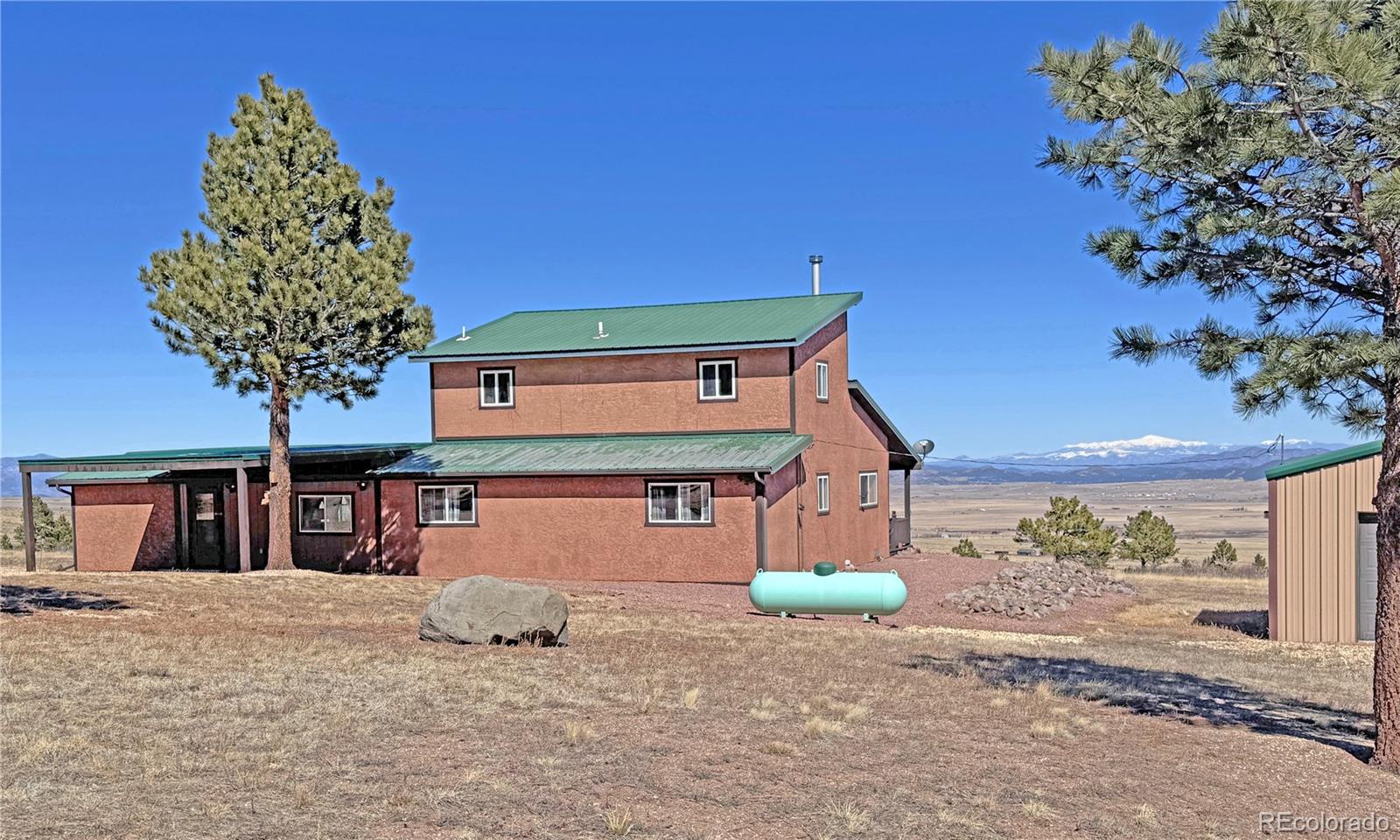 62 Rubel Road Westcliffe, CO 81252 - Photo 6 of 38 a front view of a house with a yard