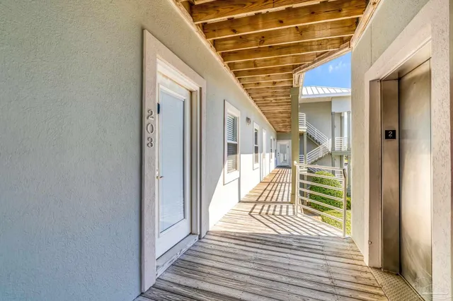 a view of a balcony with wooden floor