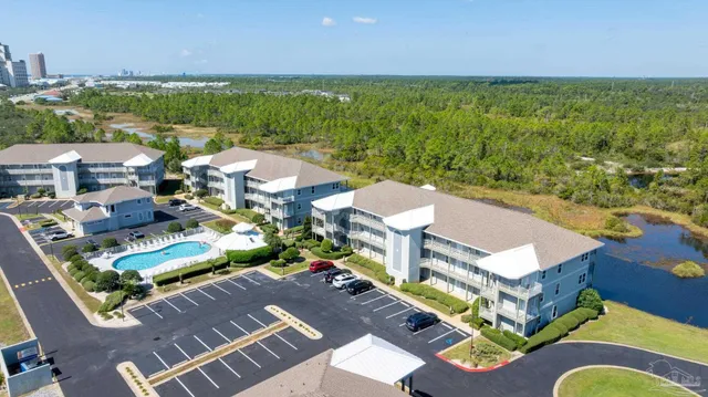 an aerial view of a house with a ocean view