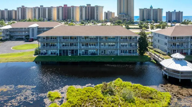 a view of a lake with a yard and green space