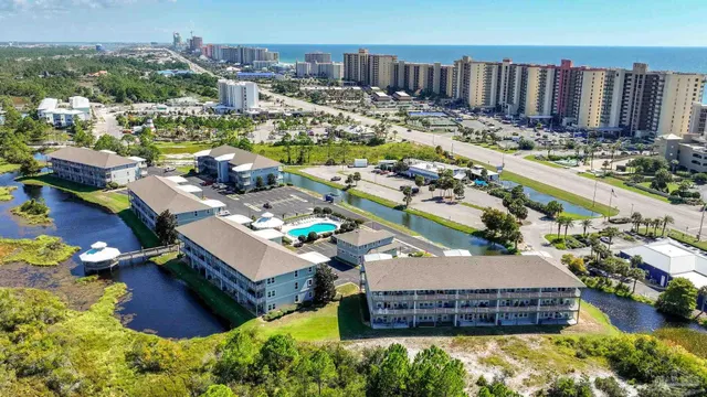 aerial view of a house with garden space and street view