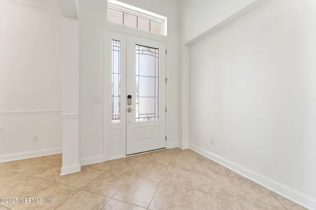 a dining room with furniture and chandelier