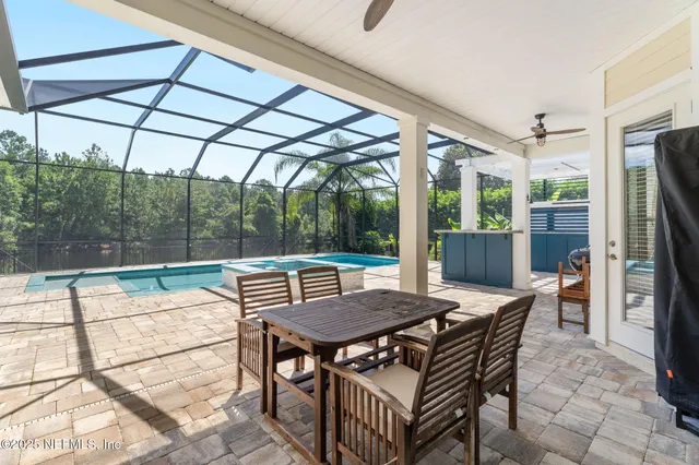 a outdoor view with a sitting space and large windows