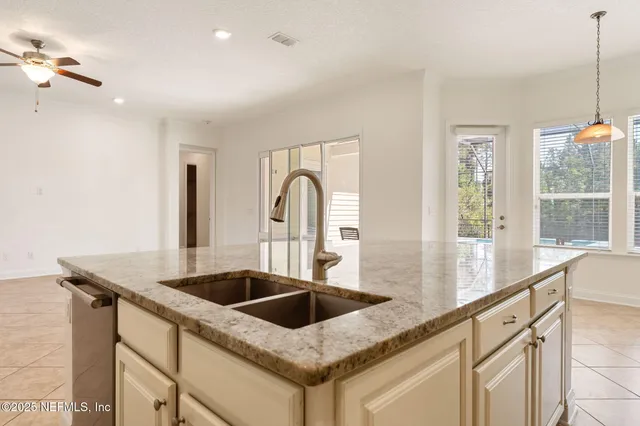 a bedroom with bed and a potted plant