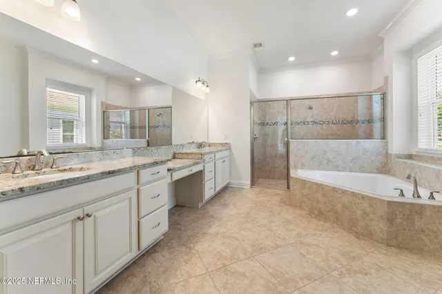 a utility room with cabinets washer and dryer