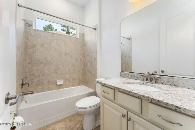 an aerial view of a house with swimming pool garden and patio