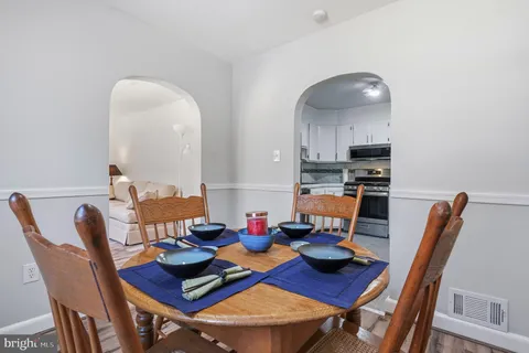 a kitchen with cabinets stainless steel appliances and a counter space