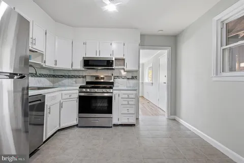 a view of cabinets and washer dryer