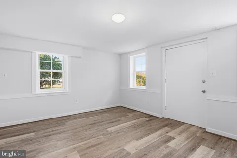 a view of a dining room with furniture and window