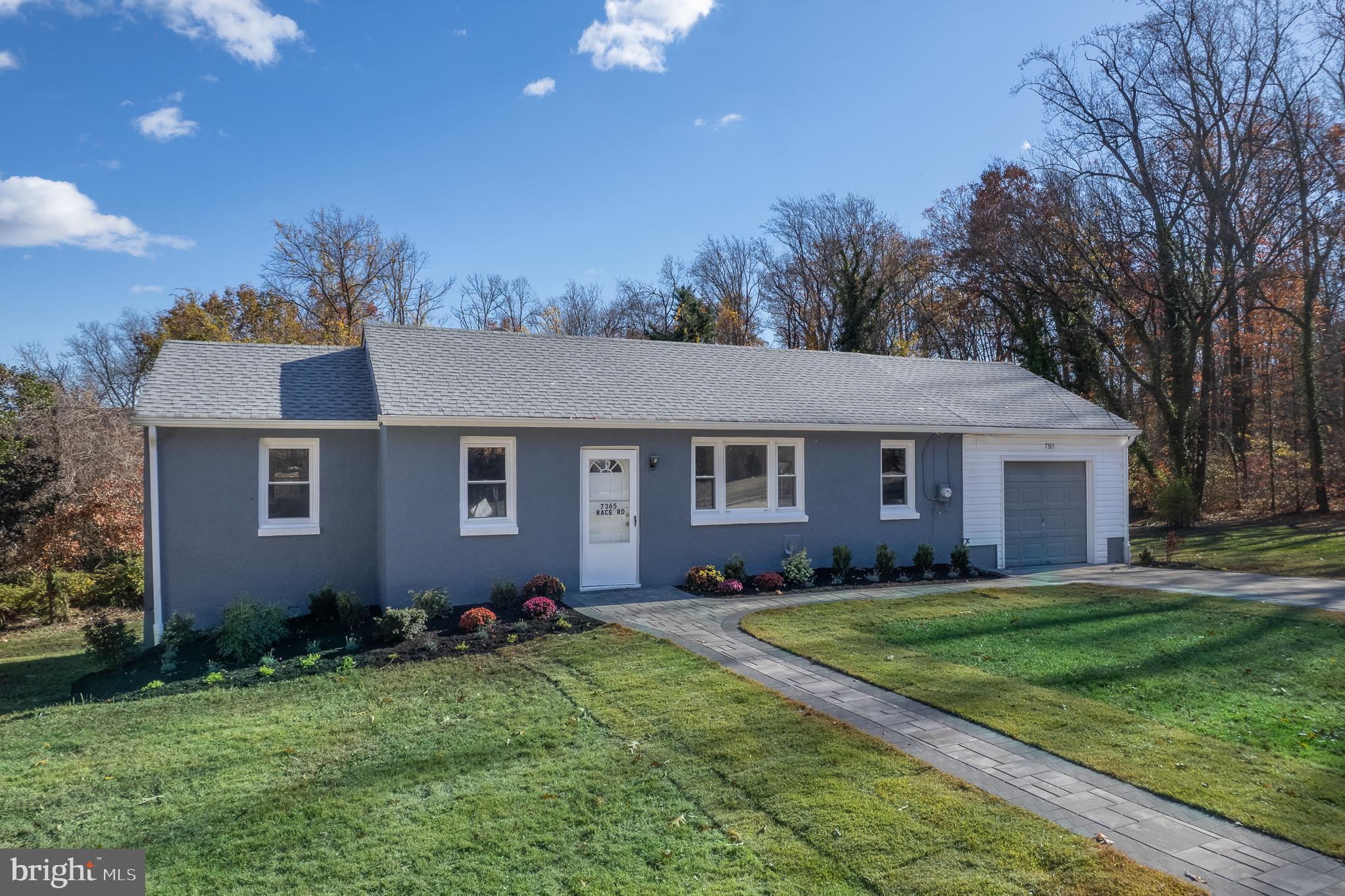 7365 Race Road Hanover, MD 21076 - Photo 2 of 68 a front view of house with yard and green space