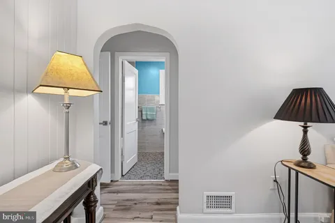 a view of a room with wooden floor