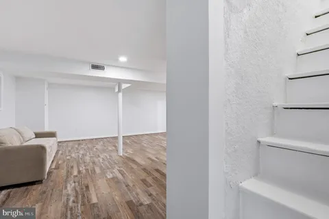 a bathroom with a sink vanity and mirror