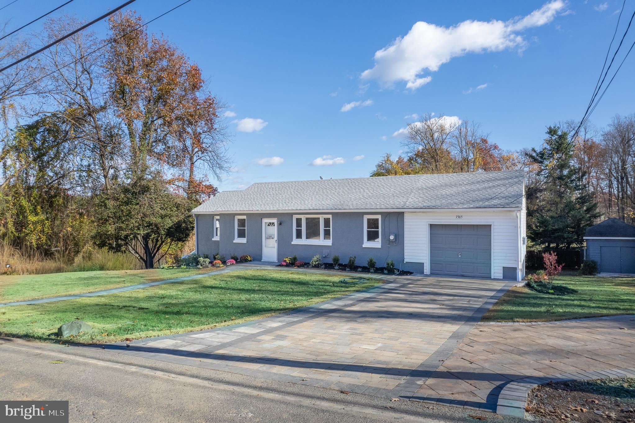 7365 Race Road Hanover, MD 21076 - Photo 3 of 68 a front view of a house with a yard and garage