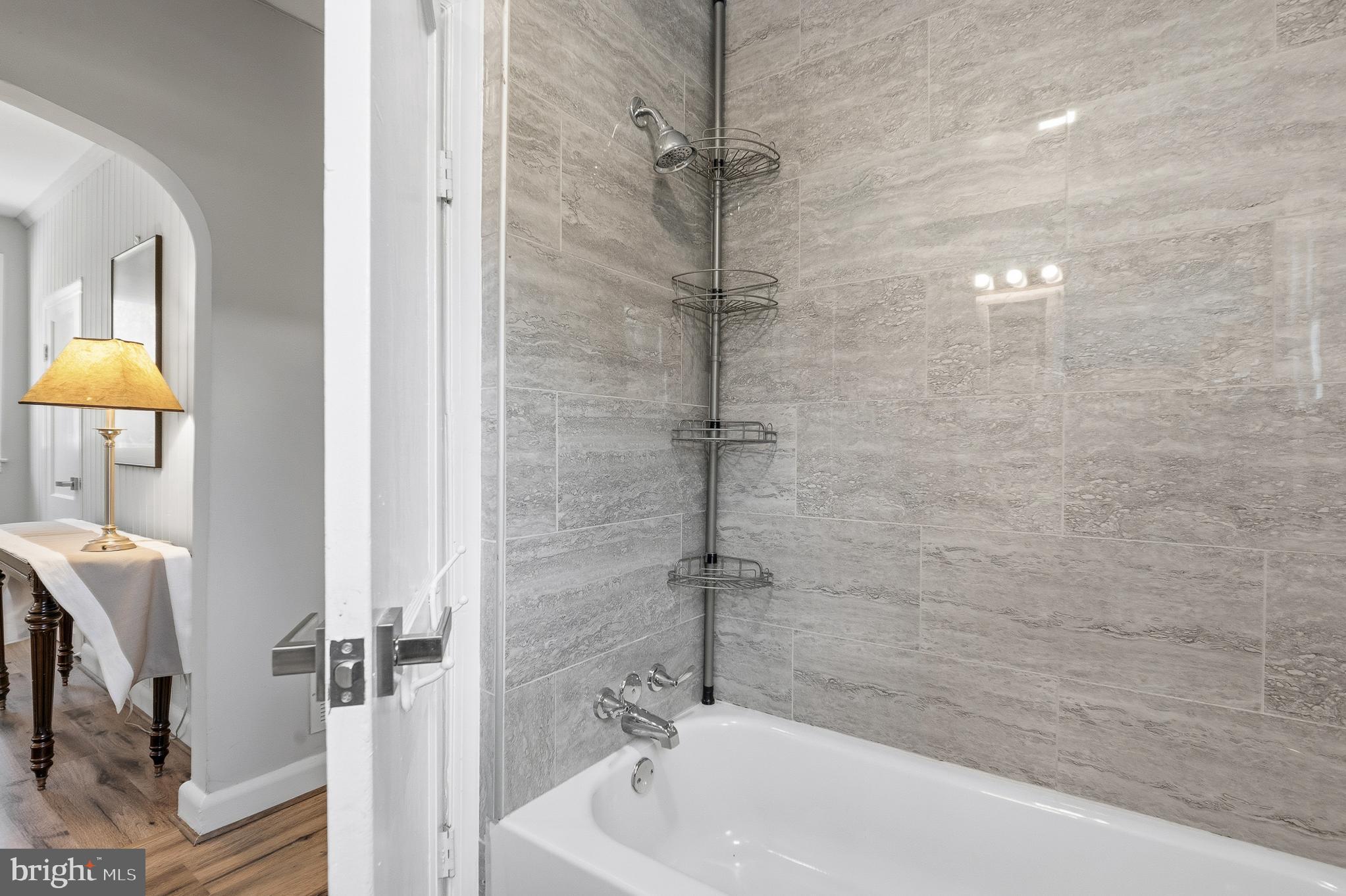 7365 Race Road Hanover, MD 21076 - Photo 35 of 68 a bathroom with a tub and a shower