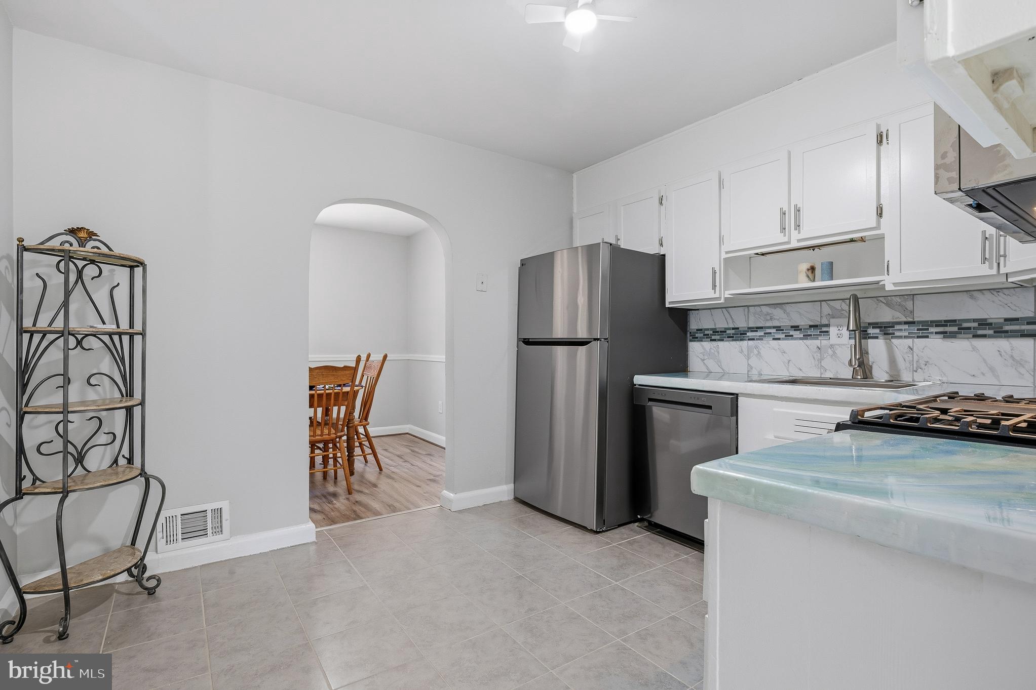 7365 Race Road Hanover, MD 21076 - Photo 4 of 68 a kitchen with stainless steel appliances granite countertop a refrigerator and a stove top oven